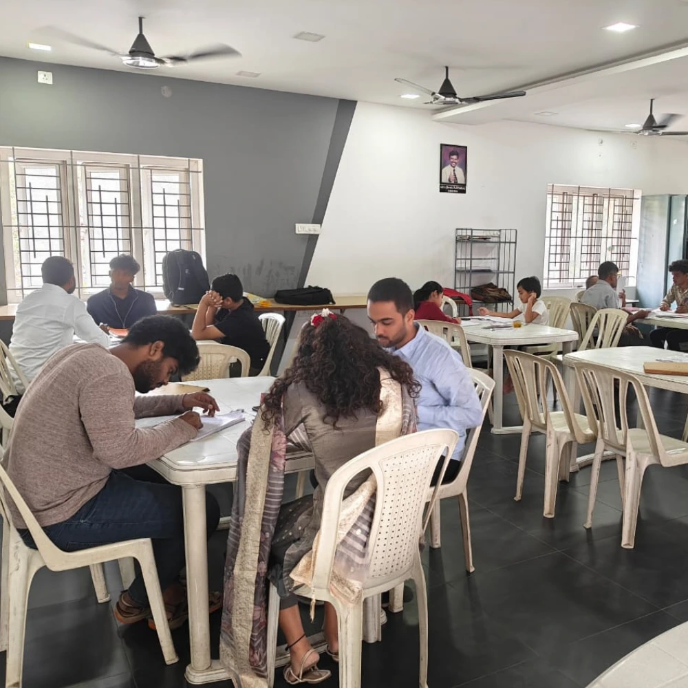 Students in classroom learning about Common IELTS Mistakes in reading and exam strategy